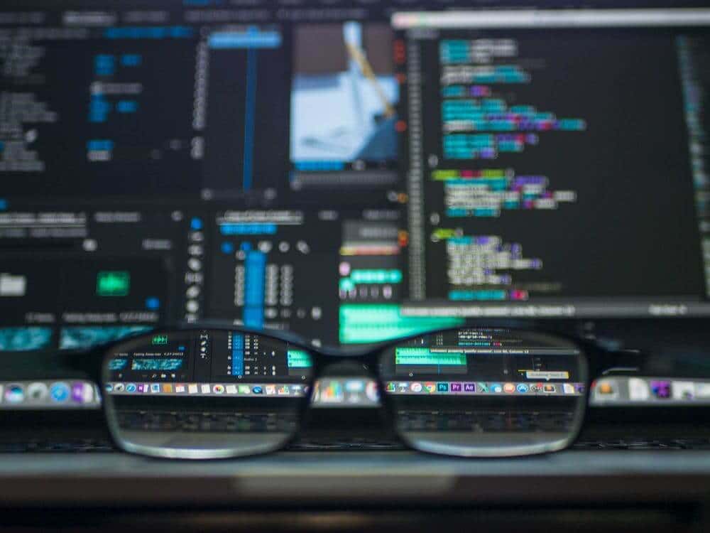 Reading glasses in front of computer screens